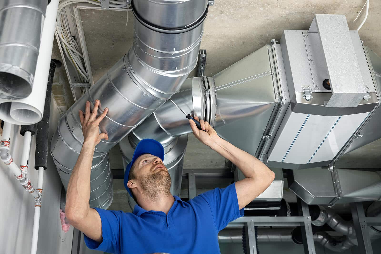 HVAC technician inspecting and repairing air ducts in Rohnert Park