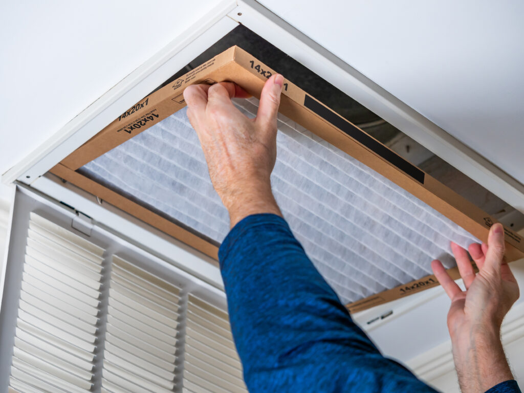 HVAC technician replacing a home air filter in Rohnert Park