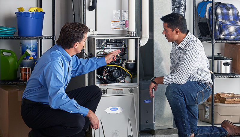 Technician evaluating a furnace for repair or replacement in Rohnert Park