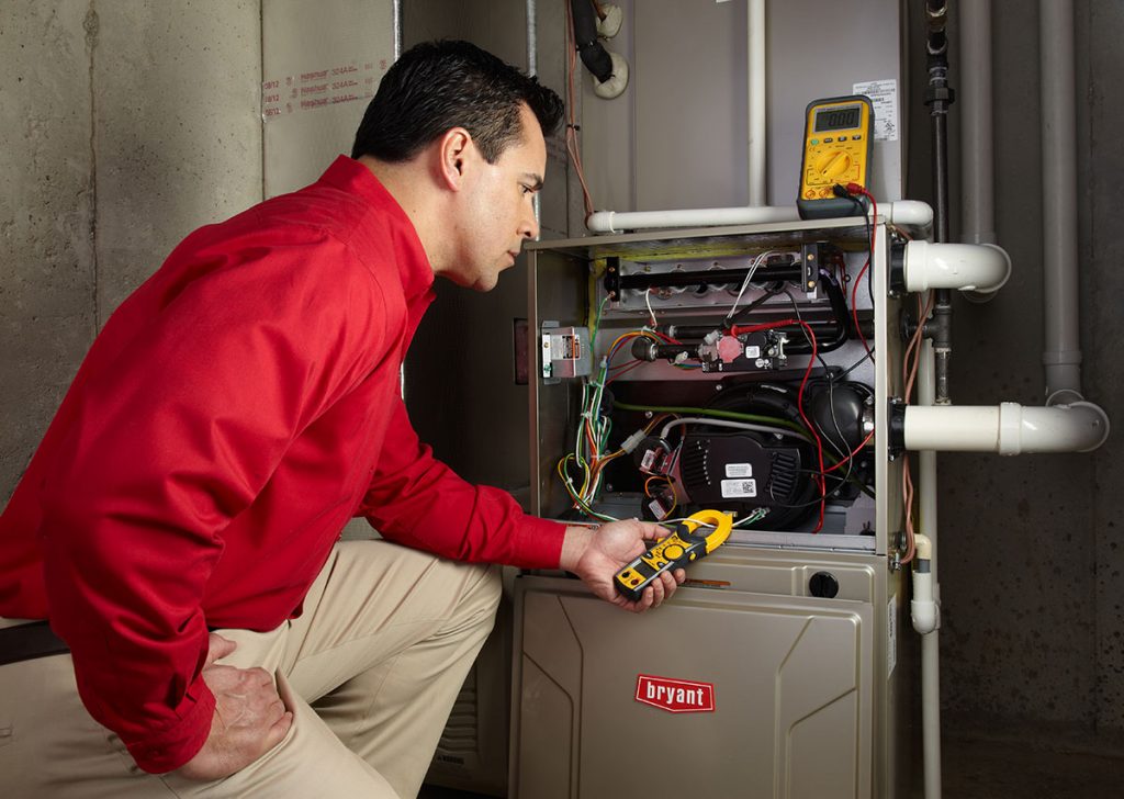 Heating technician diagnosing a furnace repair in Rohnert Park