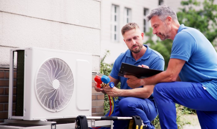 HVAC technicians installing an outdoor air conditioning unit in Rohnert Park