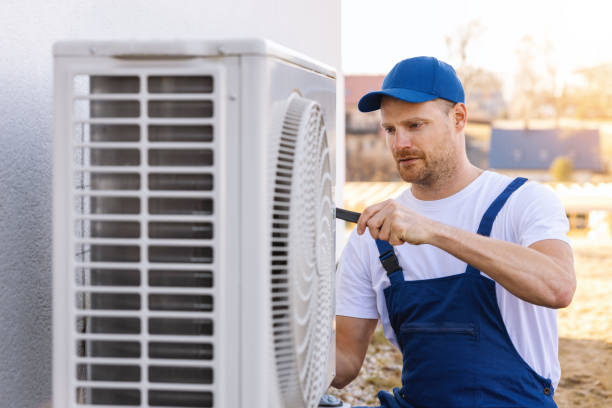 HVAC technician servicing an outdoor air conditioner in Rohnert Park