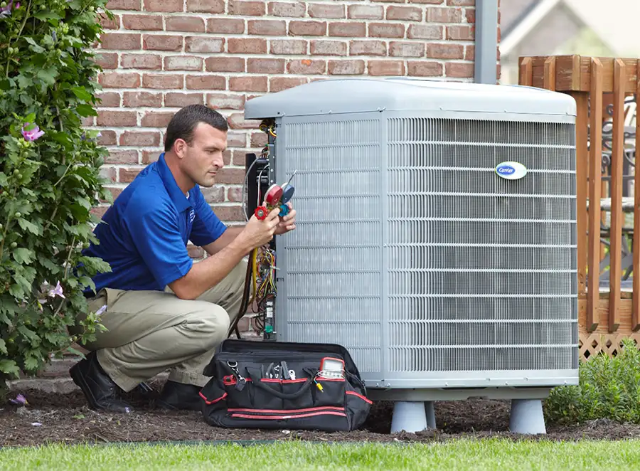 HVAC technician inspecting an outdoor AC unit in Rohnert Park
