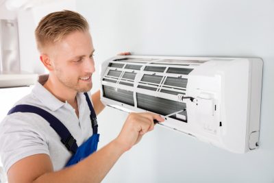 Ductless AC Maintenance Rohnert Park HVAC technician maintaining a ductless air conditioner in Rohnert Park