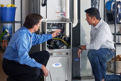 Furnace Repair or Replacement Rohnert Park Technician evaluating a furnace for repair or replacement in Rohnert Park